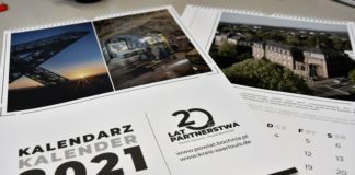 Logotyp i kalendarz na 20 lat współpracy z Powiatem Saarlouis