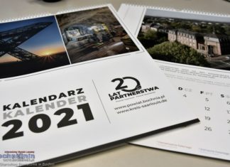 Logotyp i kalendarz na 20 lat współpracy z Powiatem Saarlouis